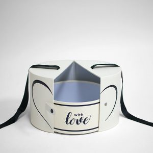white-round-flower-box-with-ribbon-and-button