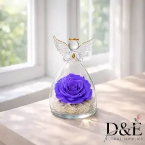 Purple preserved rose displayed inside an angel glass bottle